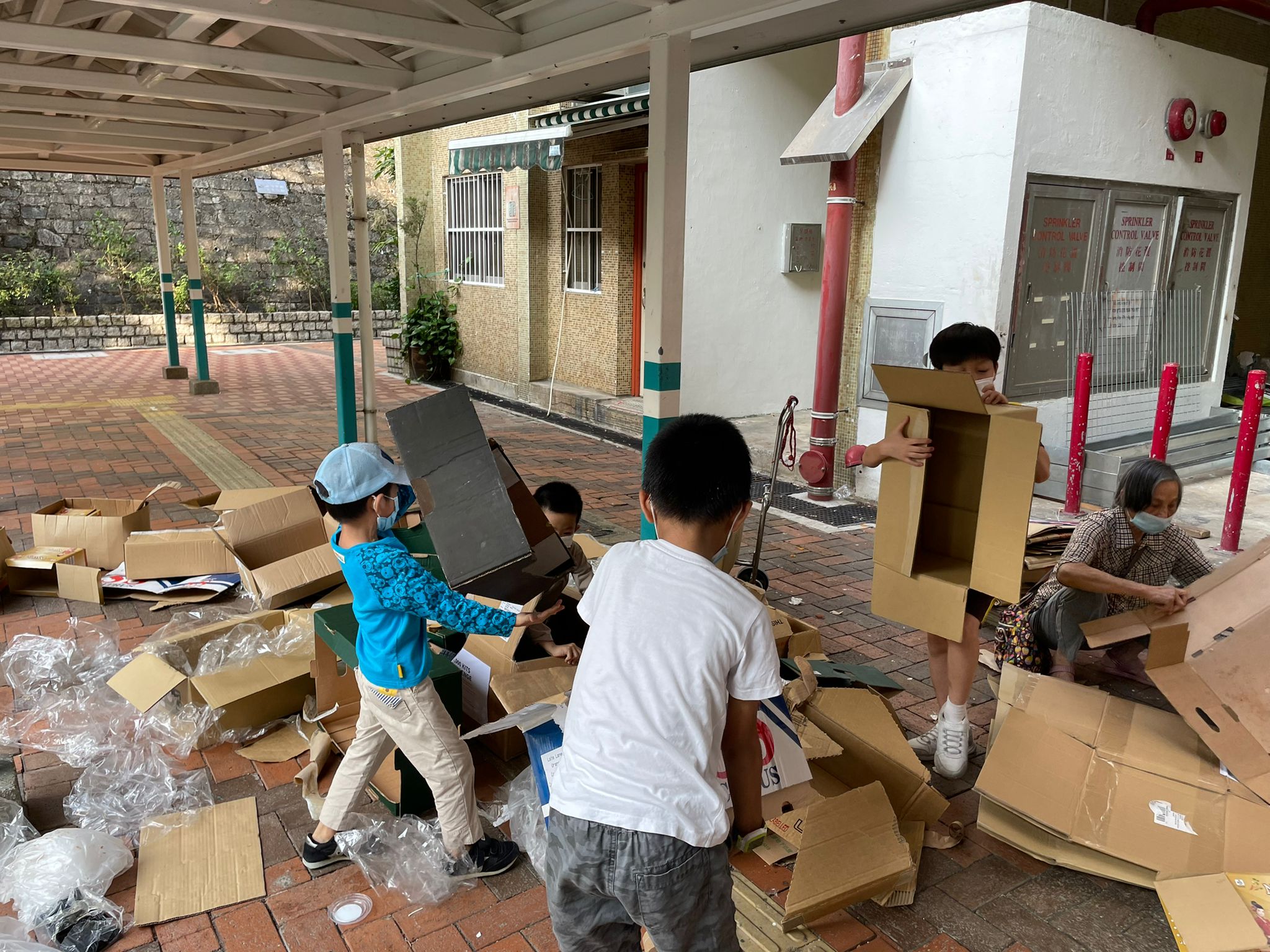 The kids were helping to clean up the boxes